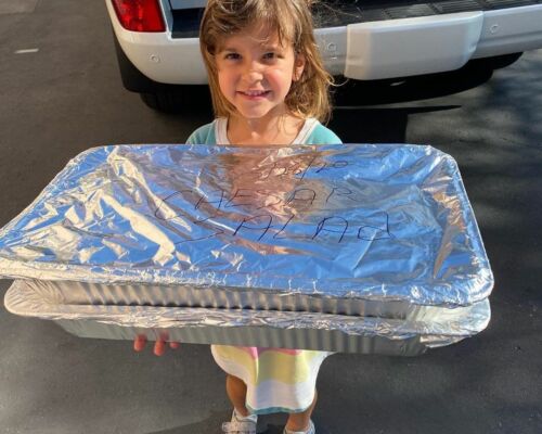 Girl volunteers to bring a meal for women in need
